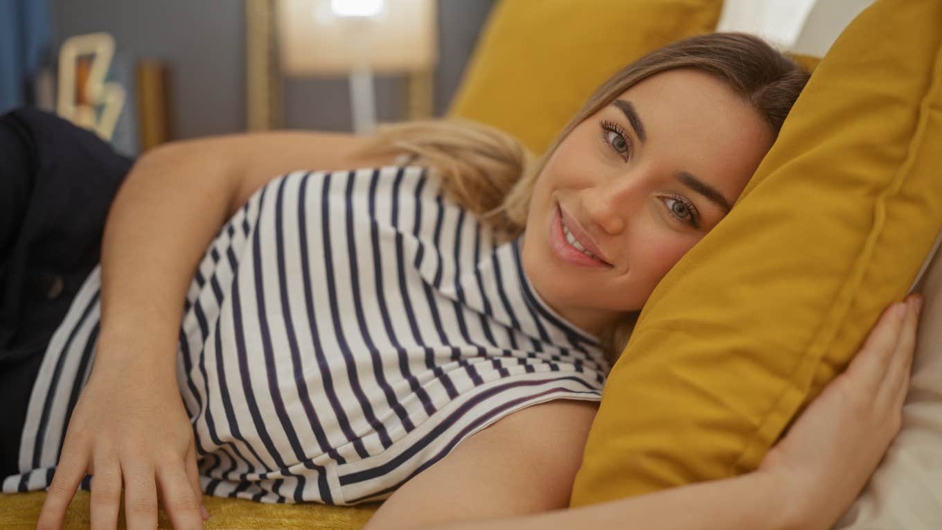 If A Wife Starts Sleeping Better Alone, She Usually Has These Reasons happy woman sleeping alone in bed