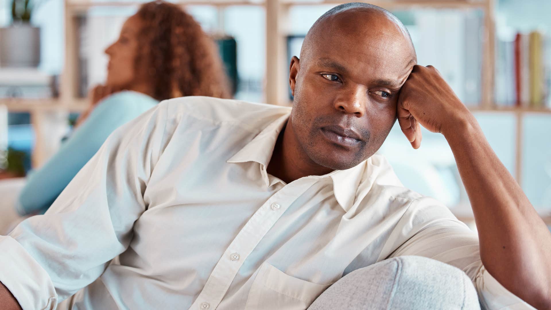 Man who's angrier and more defensive turned away from his wife.