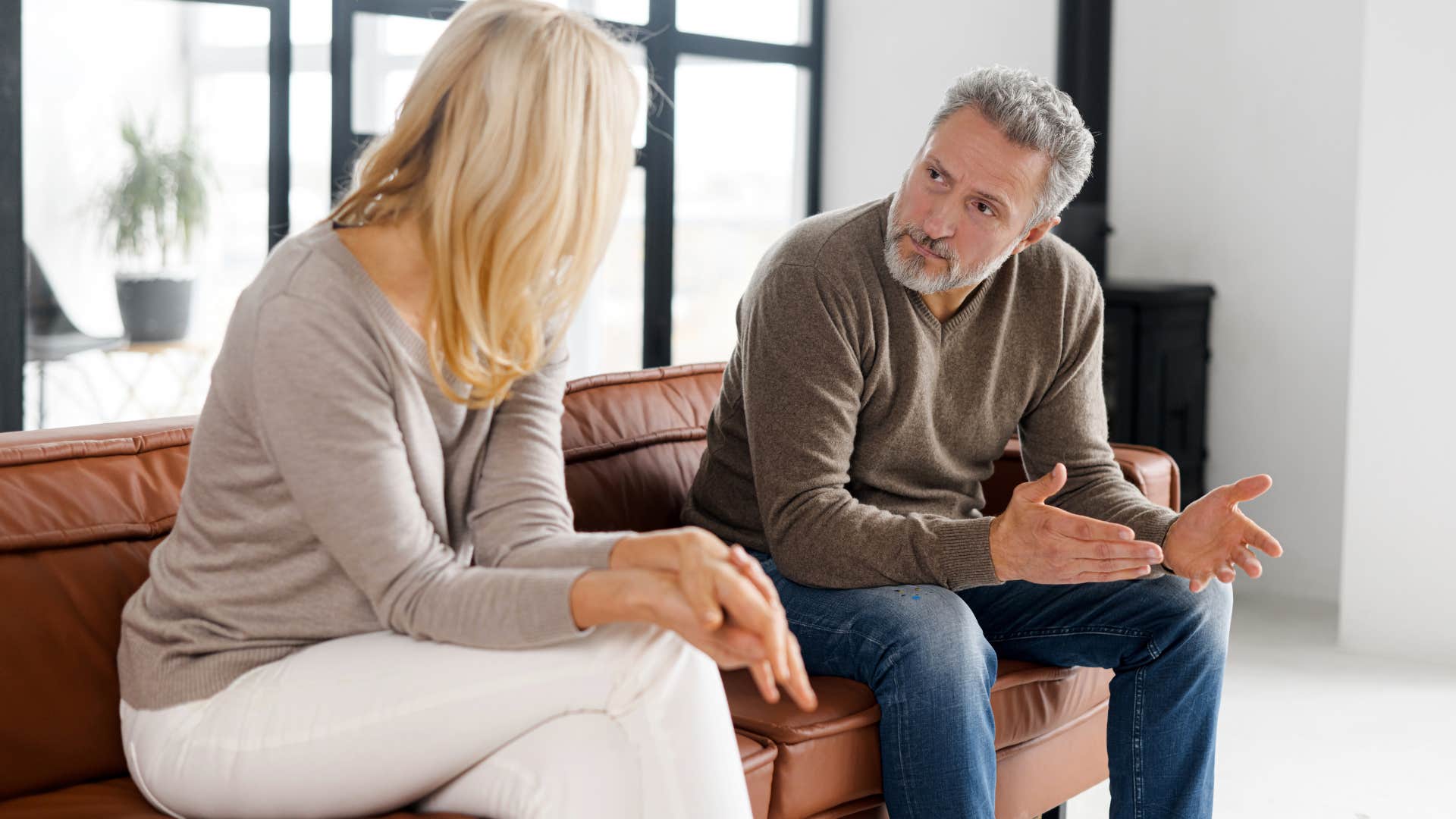 Man who makes hurtful jokes talking to his wife.