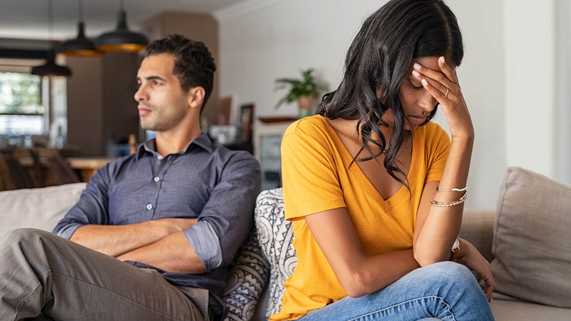 Woman turned away from her husband who never gives compliments anymore.