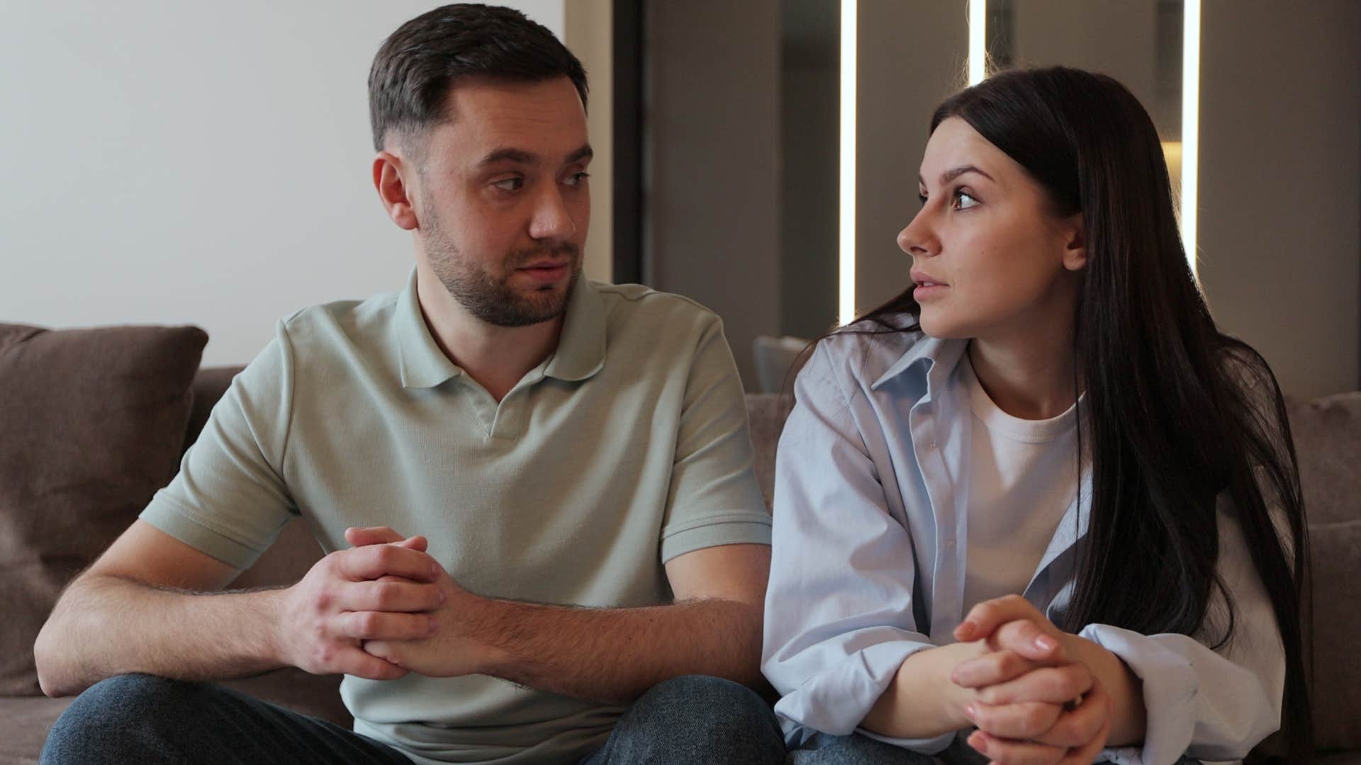 Man who's stopped asking questions arguing with his wife.