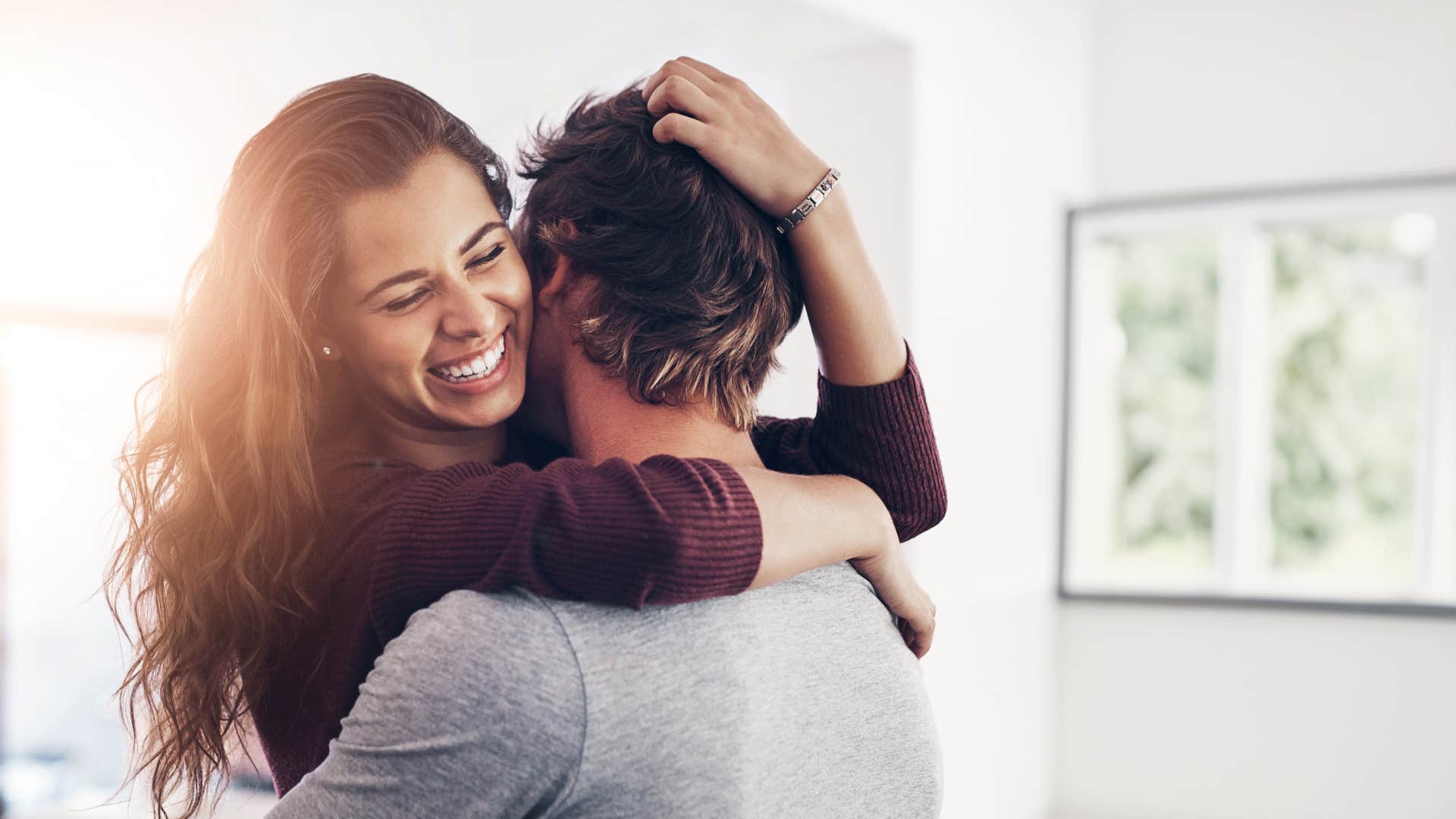 woman smiling hugging her partner