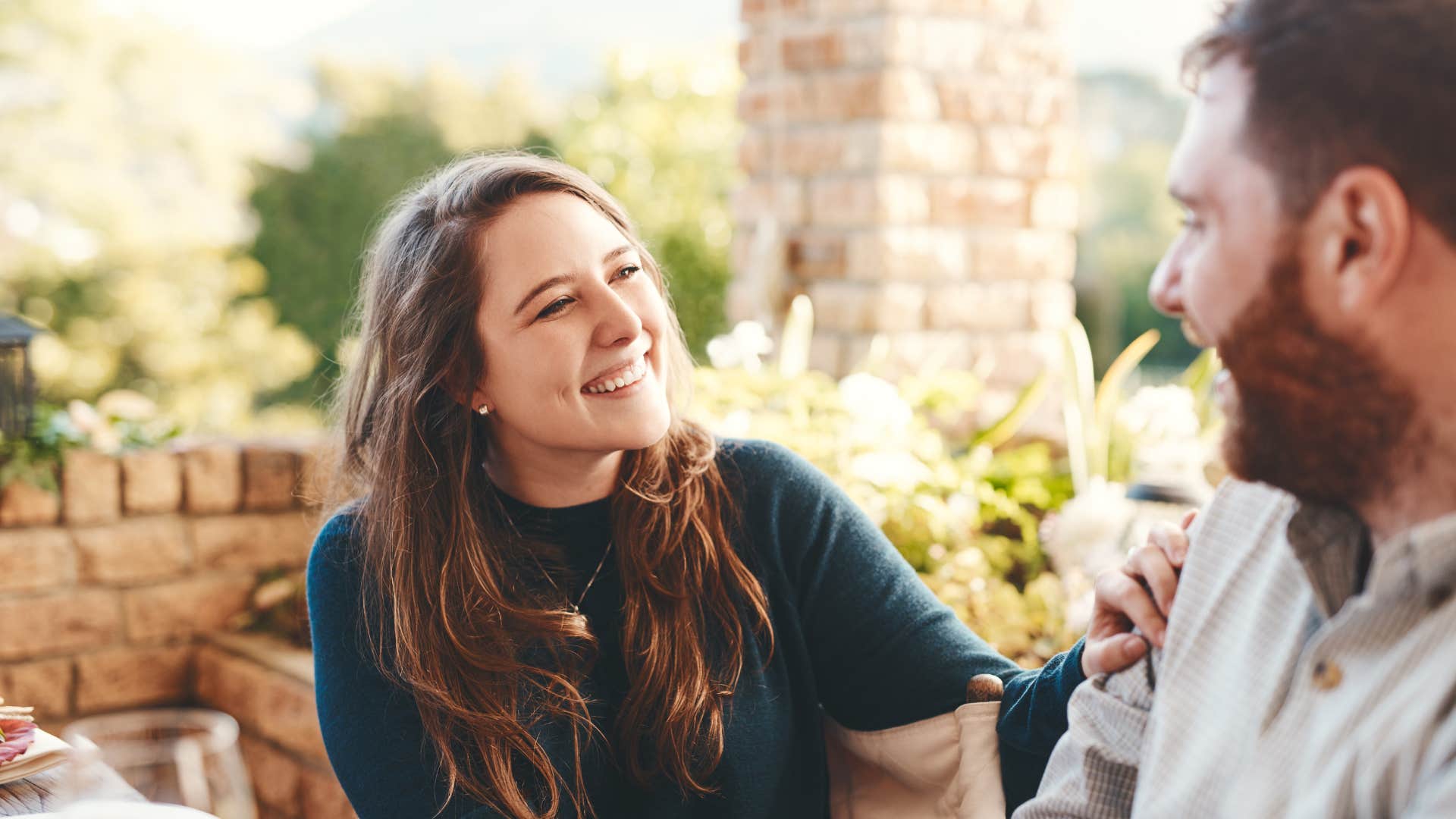 woman telling partner shes fine faking a smile