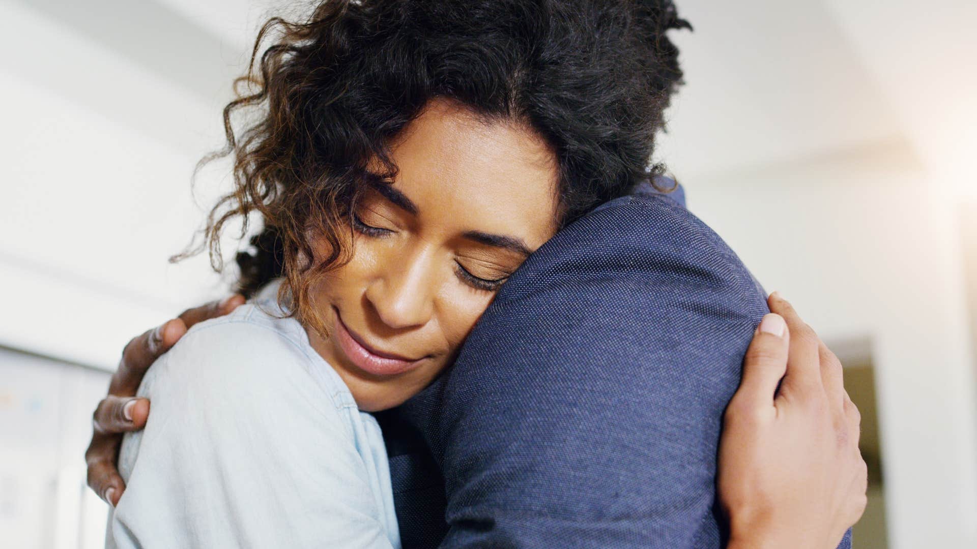woman hugging partner