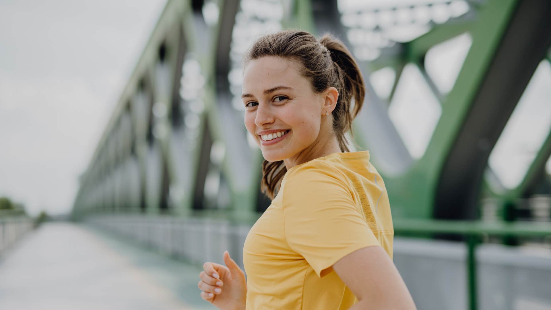 woman smiling jogging for health