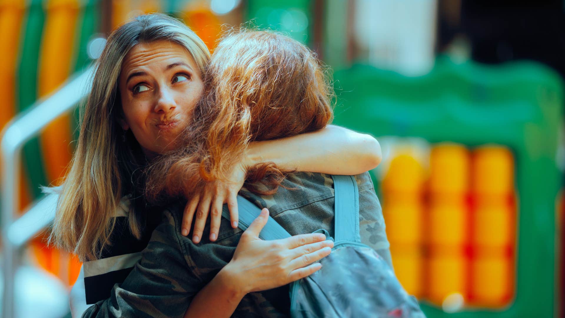 if a woman does these things, she's likely scaring off really good friends jealousy or competitiveness  jealous woman hugging friend