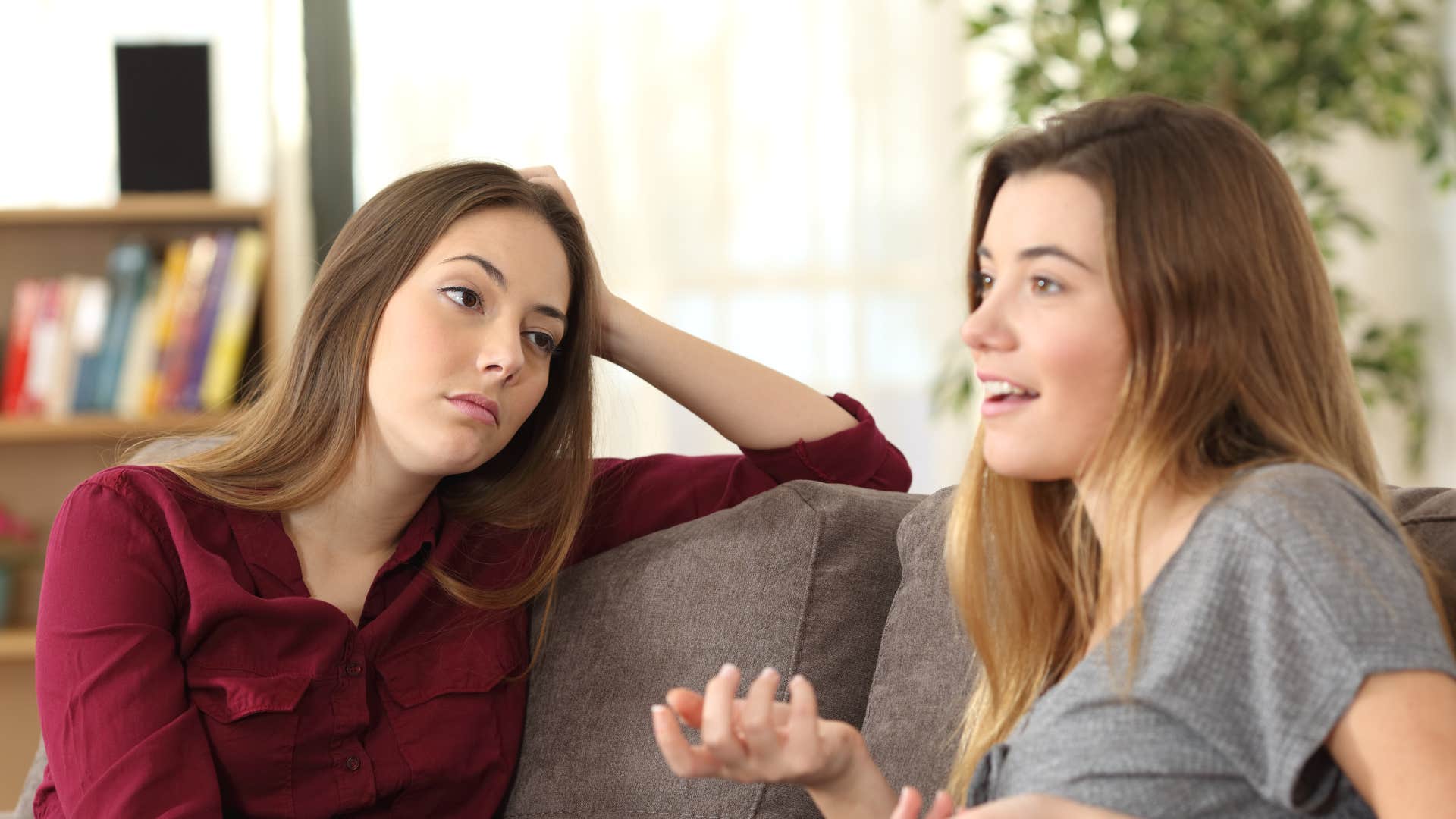 if a woman does these things, she's likely scaring off really good friends one sided conversations woman looking annoyed at friend who wont stop talking