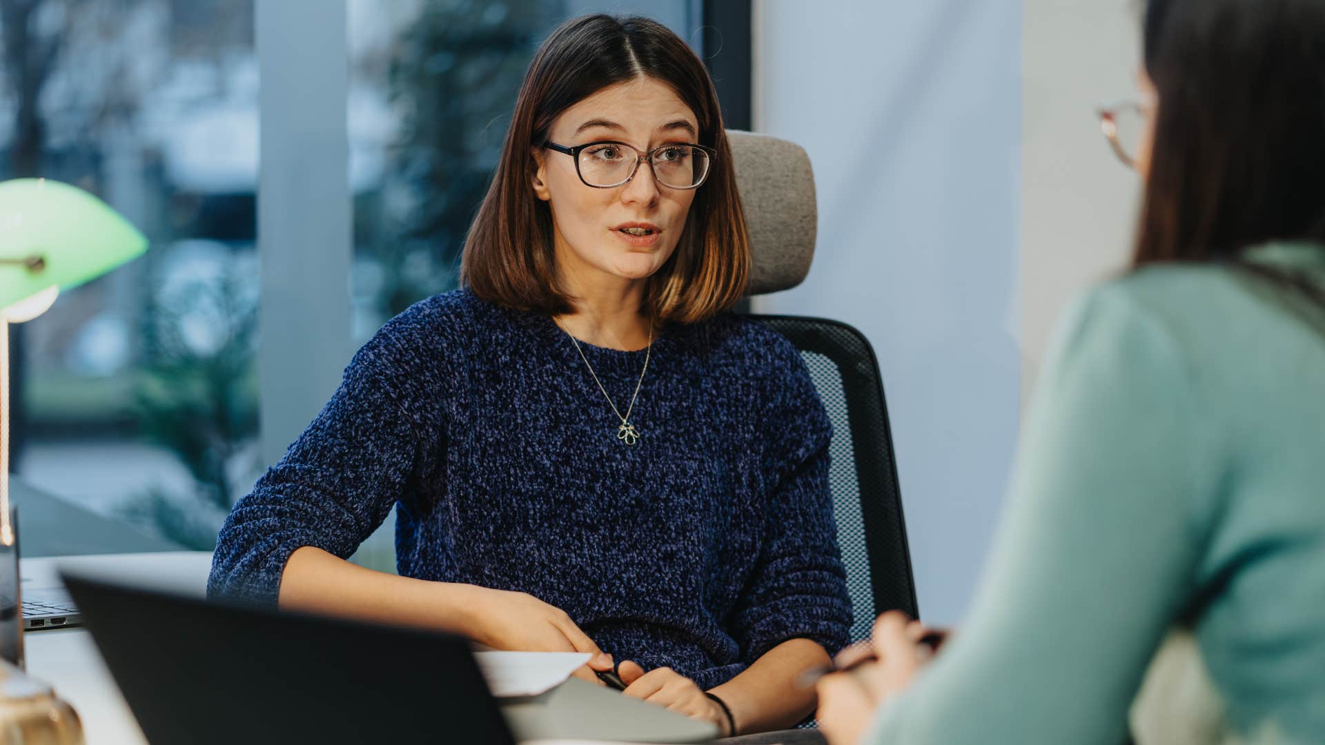 woman who's always saying yes talking to a co-worker