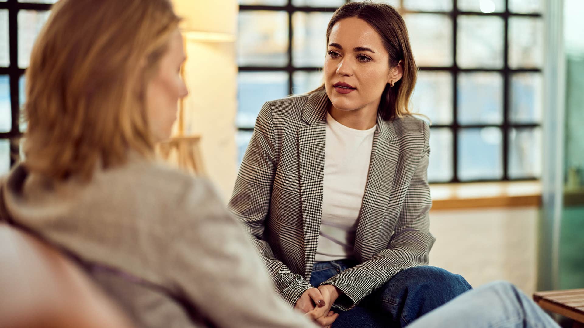 woman over-apologizing to a friend