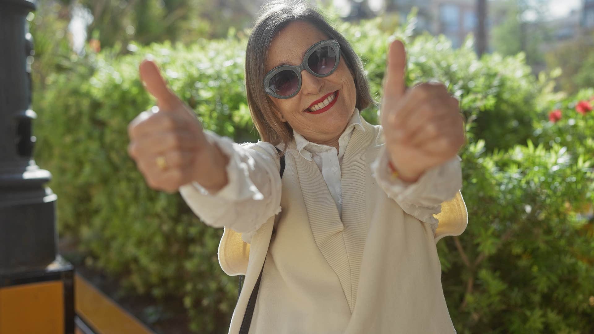 Woman who doesn't apologize for being themselves smiling.
