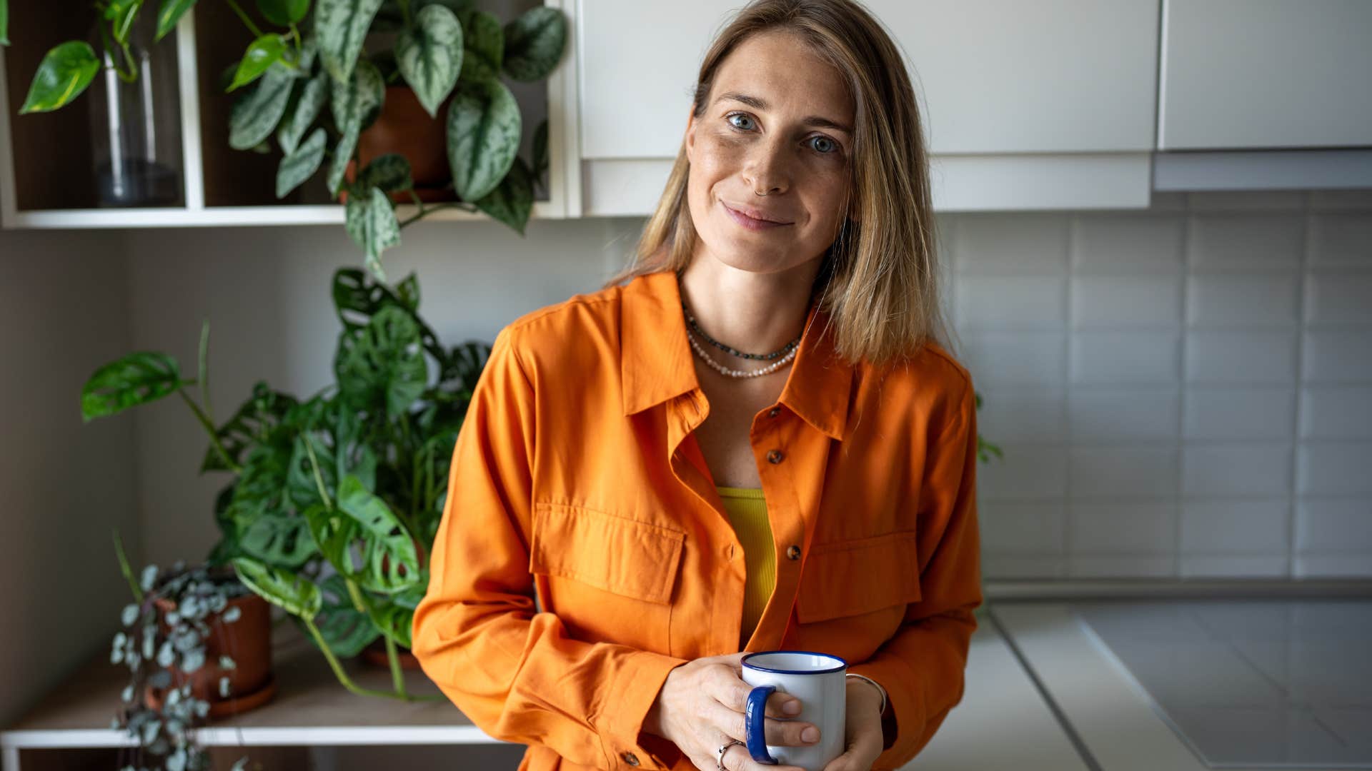 Feminist woman smiling at home.
