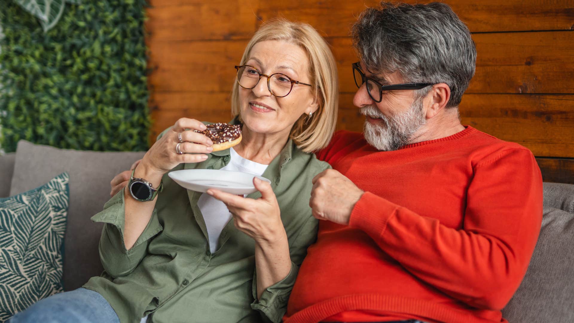 Woman who finds meaning in vulnerability eating with her partner.