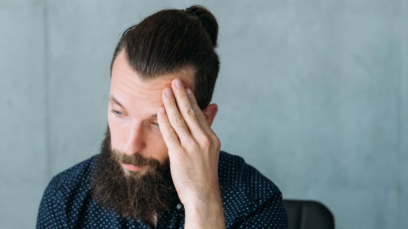 Worker With 30 Years Of Experience Contemplates Selling His Home Because He Can’t Find A Job Upset unemployed young man thinking hard.