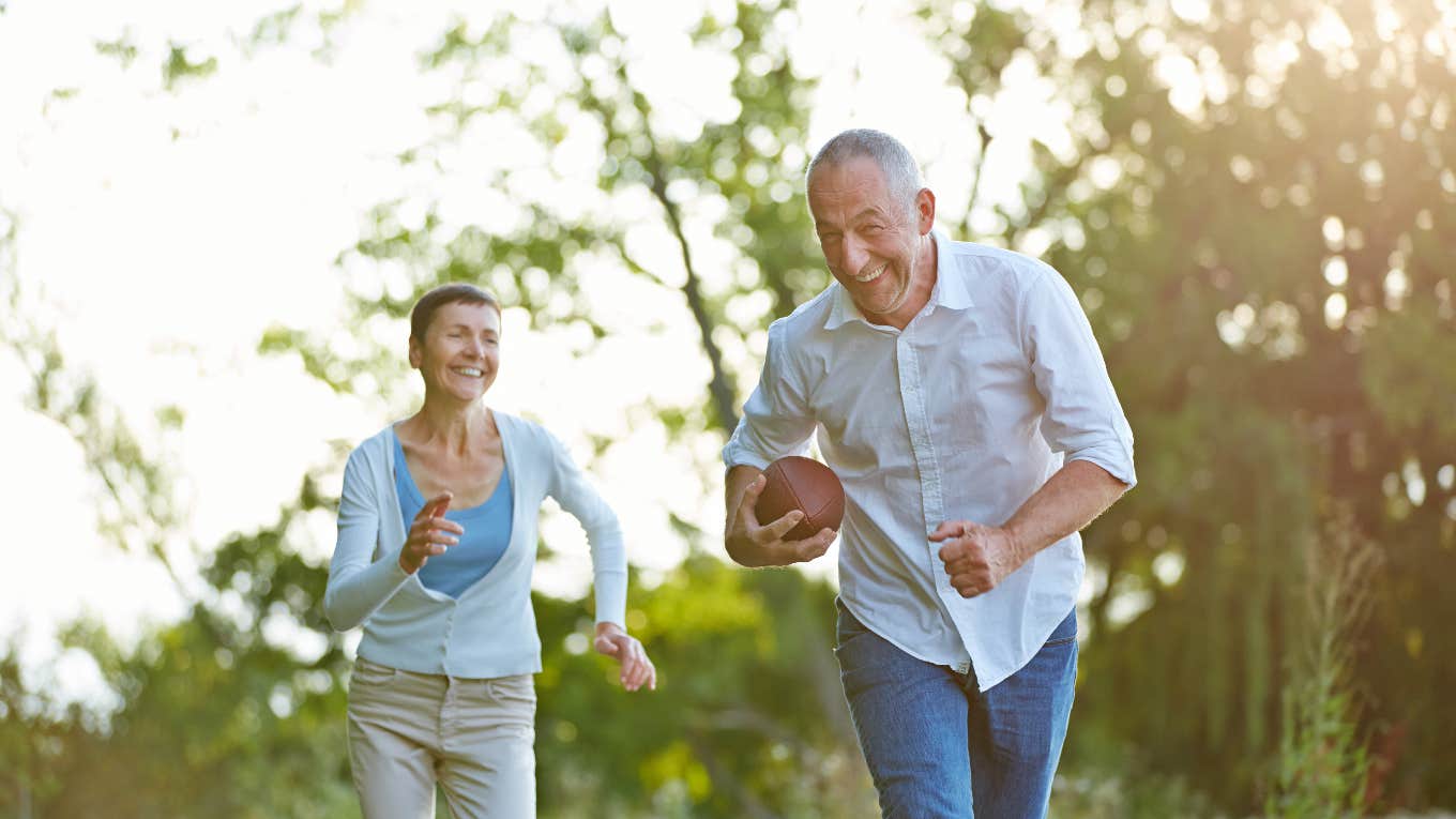 older man playing football