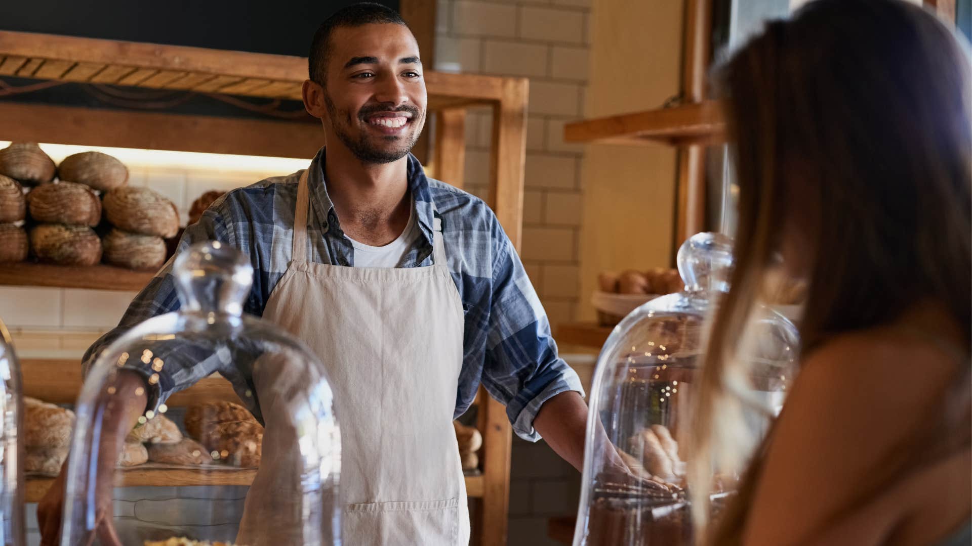 man thinking about how he treats people at a coffee shop