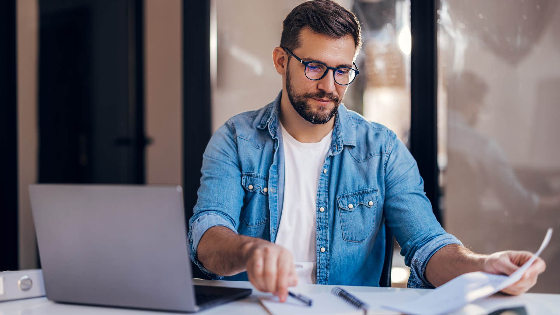 man making life decisions while working