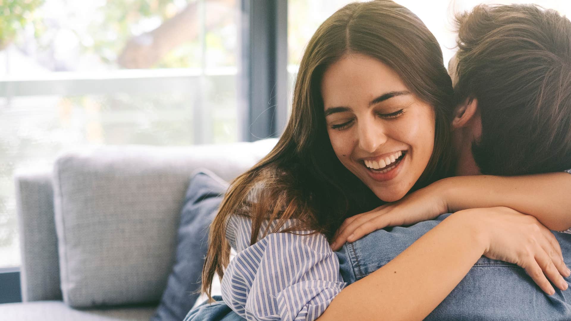 woman hugging partner who loves her authentically