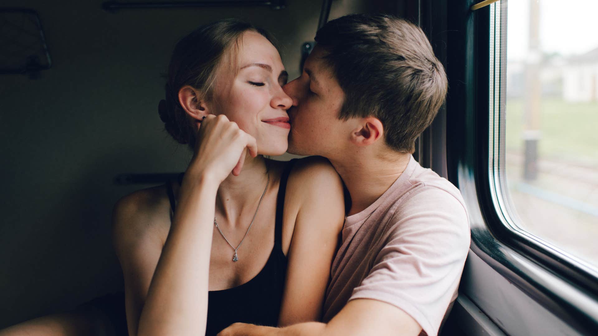 man making his partner feel safe hugging her close