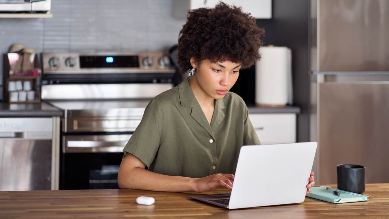 young woman working on laptop