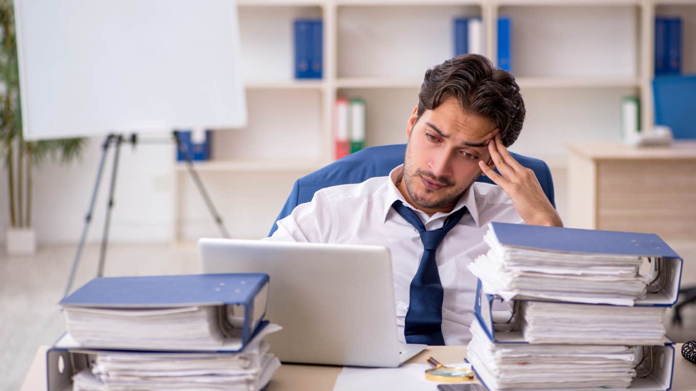 stressed employee sitting at desk