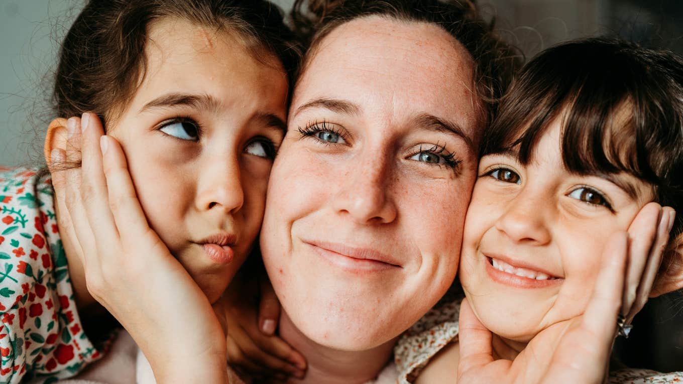 Mother engaged with her children in a loving and attentive way, representing natural maternal instincts, parenting best practices, and emotional connection in motherhood.