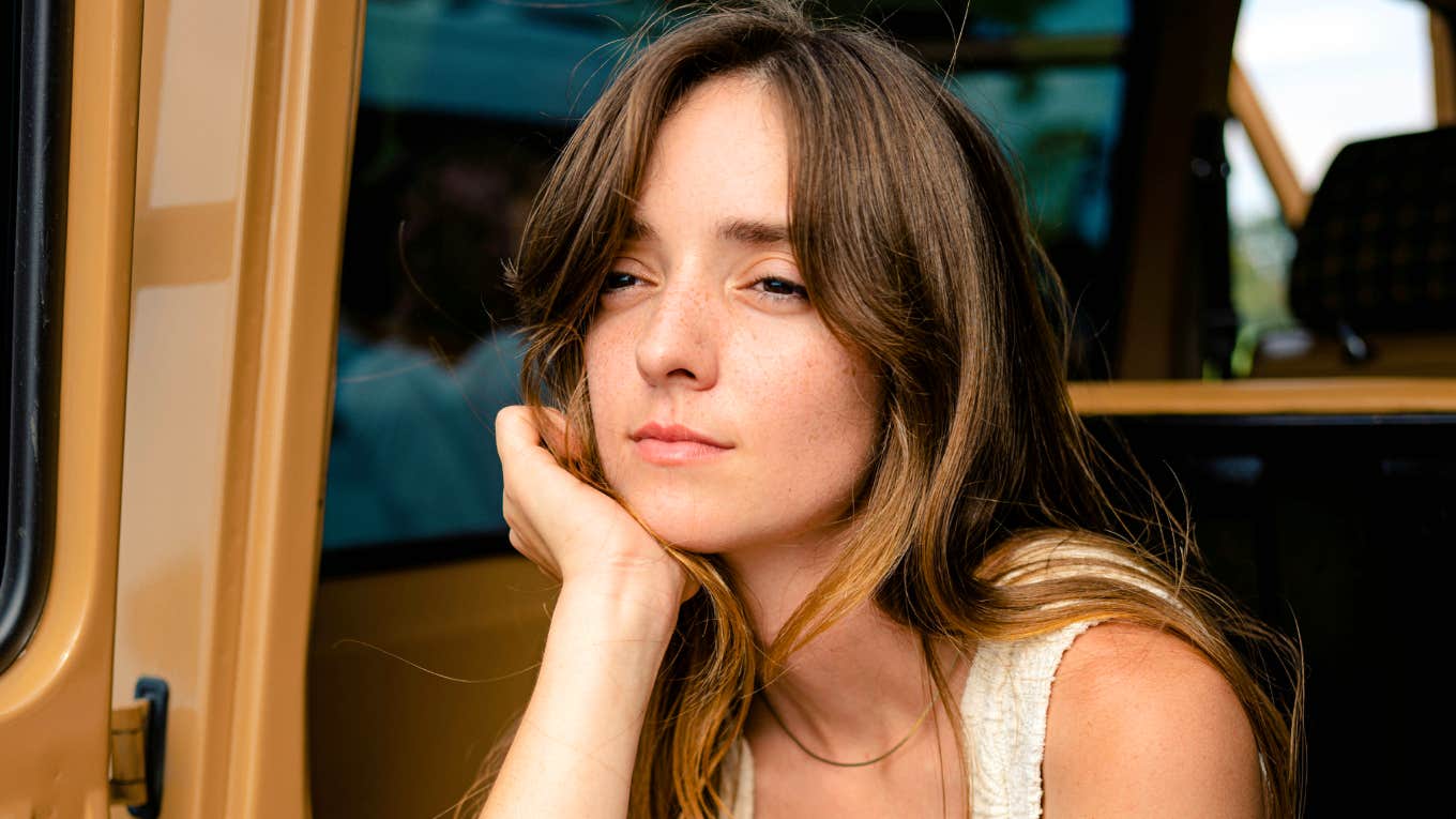 Carefree person sitting in the back of a car, lost in thought as sudden mental clarity breaks through—capturing the art of clear thinking and habits that erase brain fog instantly