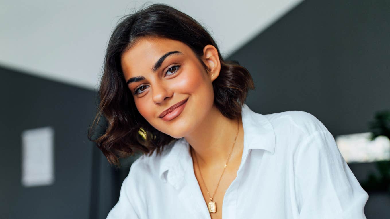 Confident professional receiving positive recognition at work showing the art of getting promoted and the habits of naturally promotable people