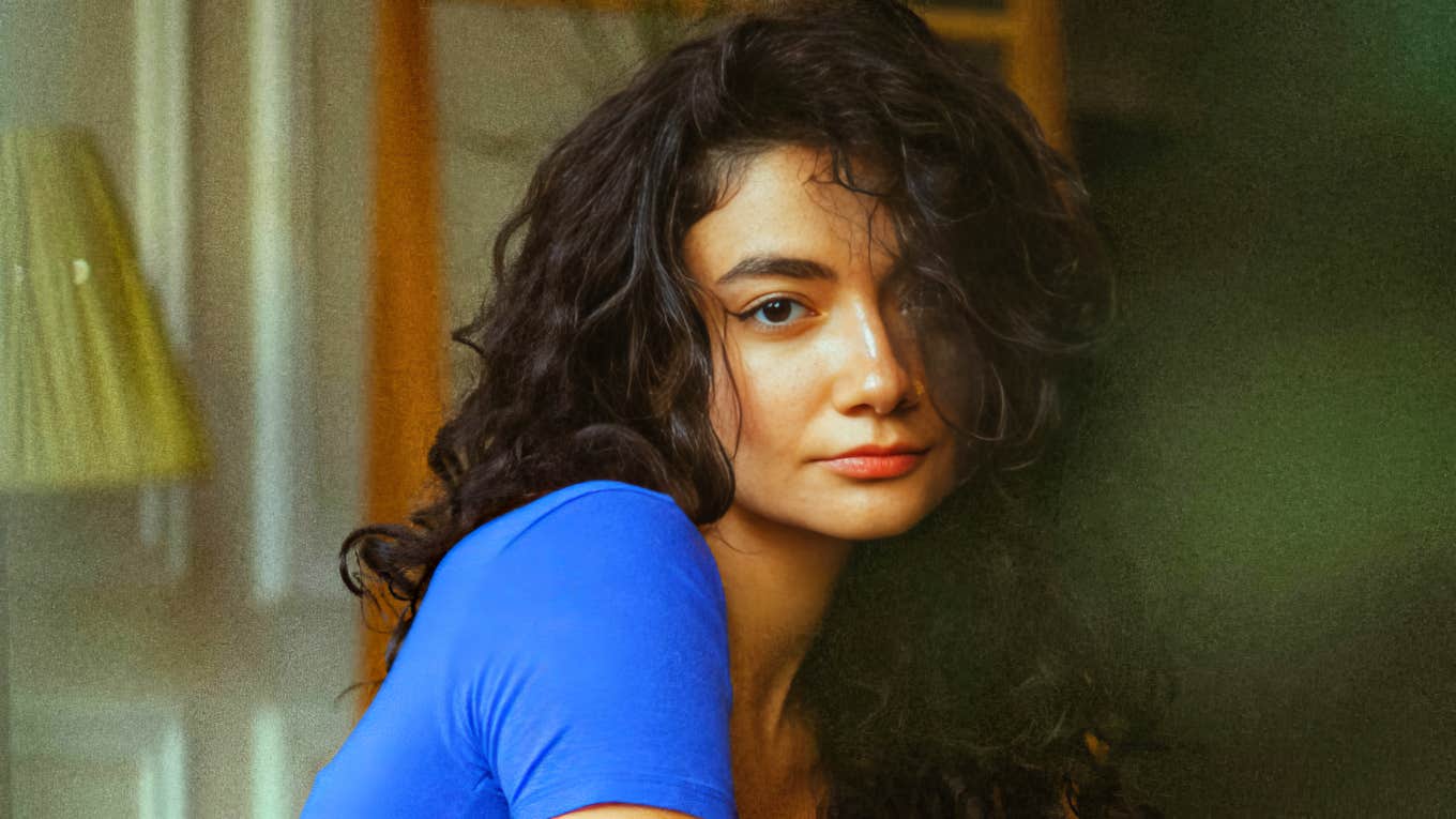 Calm, thoughtful person sitting quietly, representing the subtle habits intuitive people use daily to sense what others miss and trust their inner knowing.