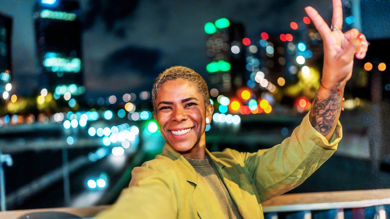 Happy, confident young Black woman in the city showing the art of a better life and habits of people who aren’t miserable