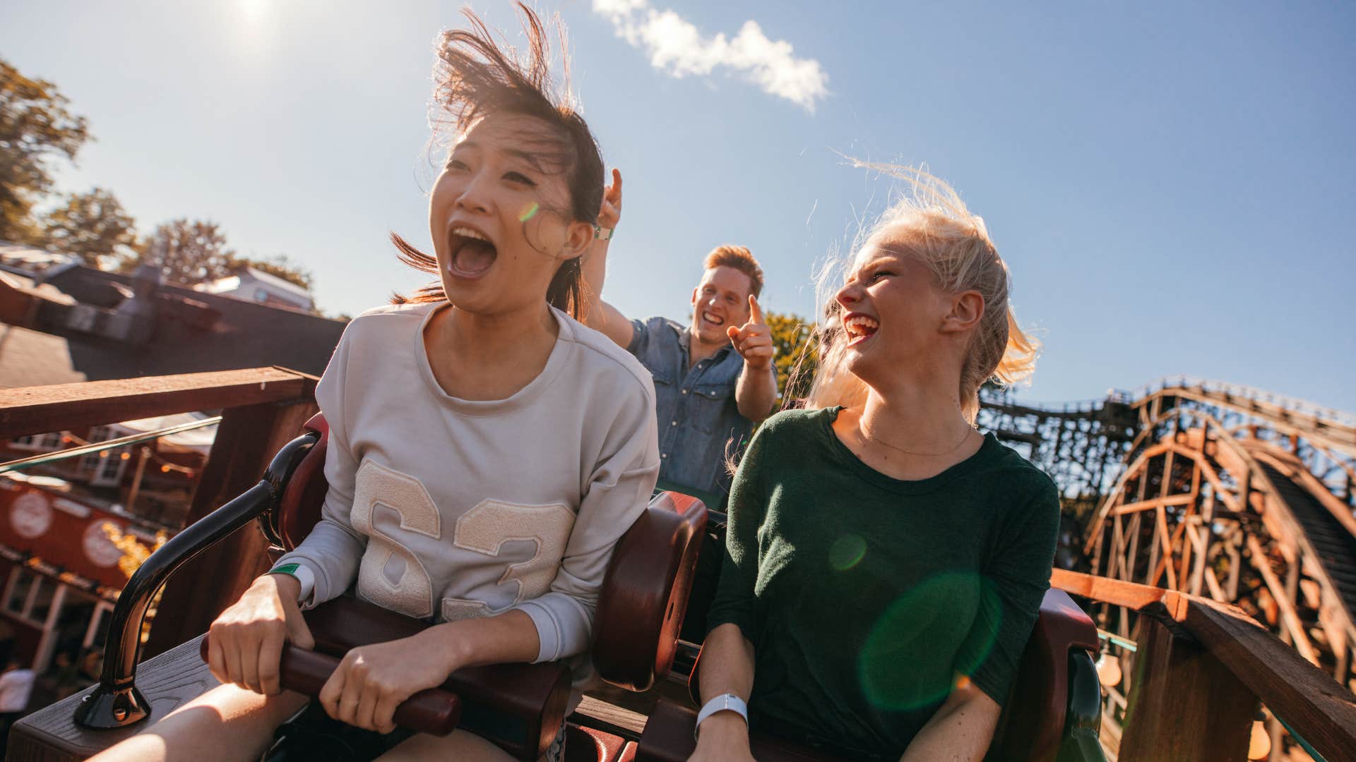 Irreplaceable person rides rollercoaster with energetic friends