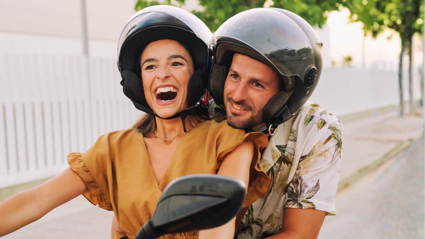 Confident, secure girl riding a motorcycle showing the art of being secure and habits of people who aren’t frantic about being loved.