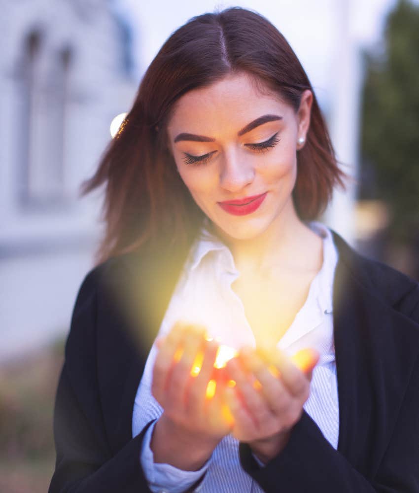 Person feeling light of love in their hands
