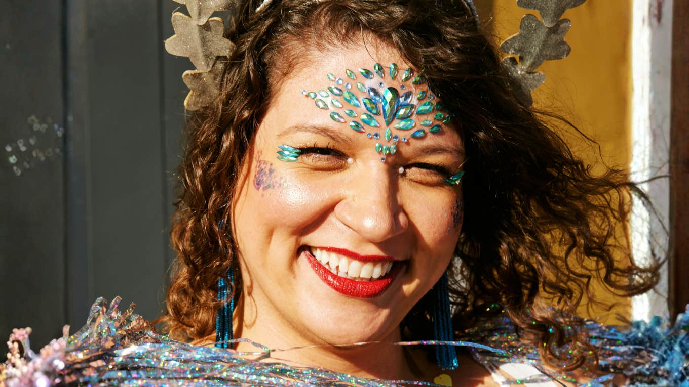 Confident, whimsical woman showing the art of pixie dust and habits that make all dreams come true.