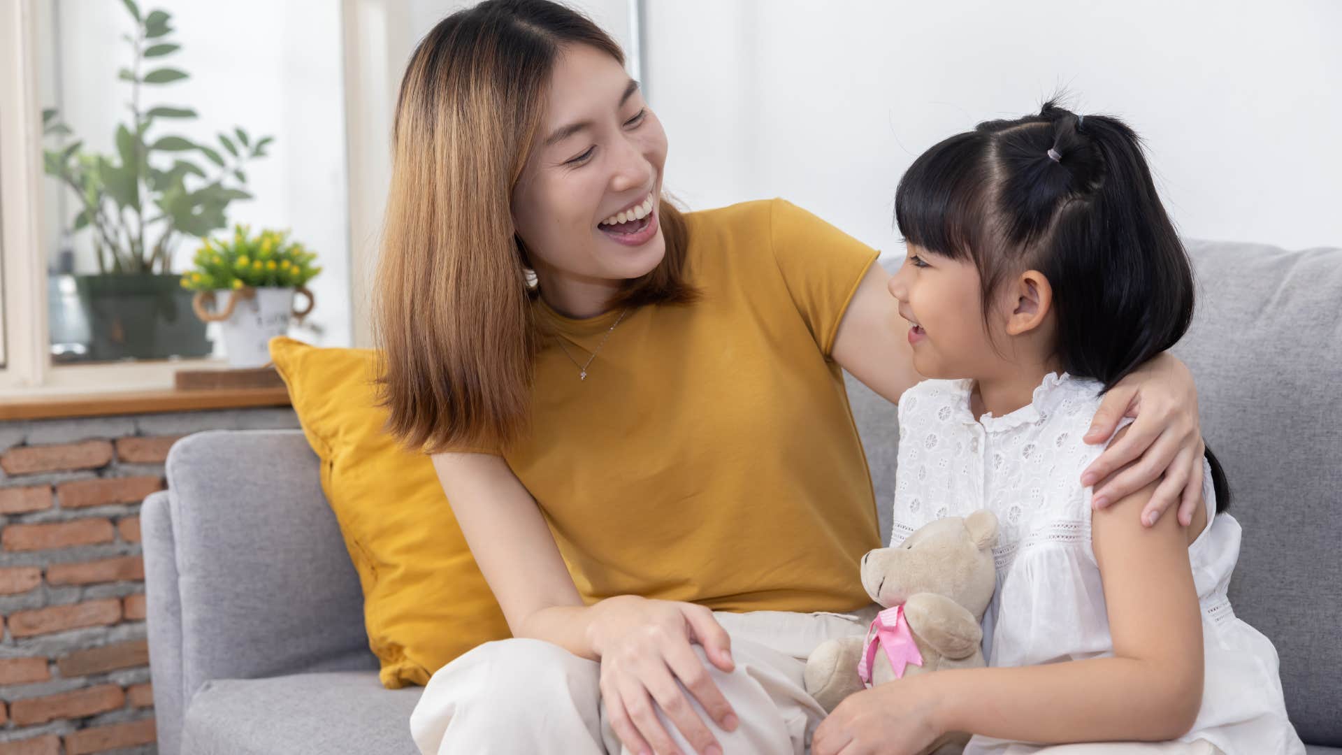woman raising confident daughter as she tells her to not give up on love