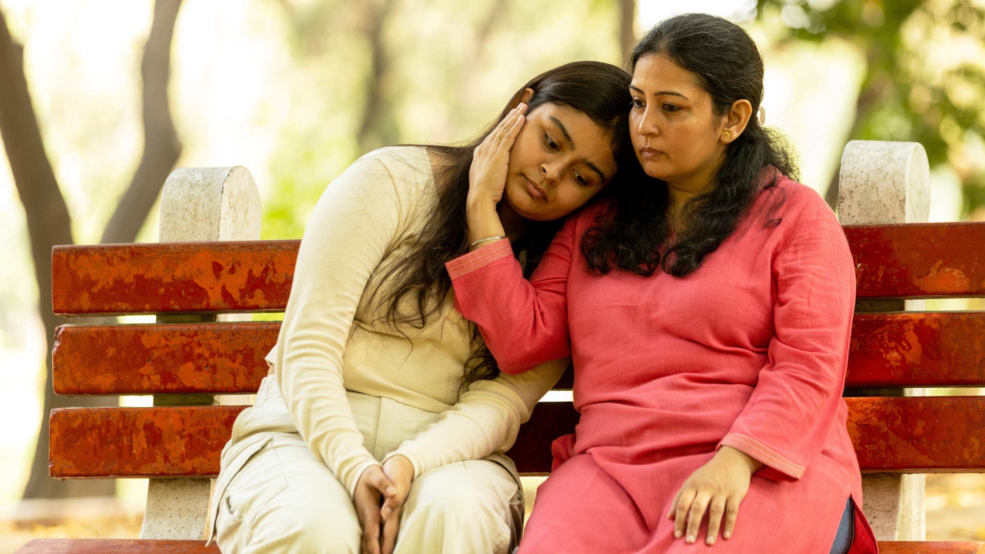 woman raising confident daughter by telling her to not ignore bad behavior