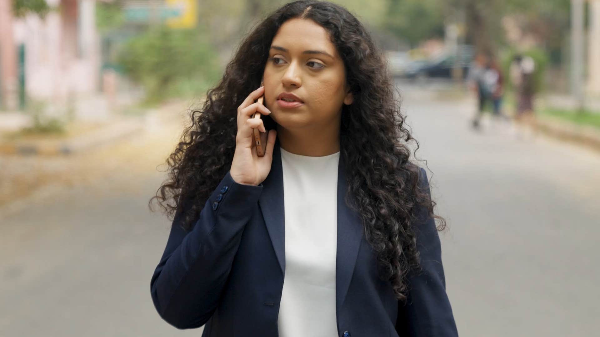 woman saying I'm just really busy on the phone