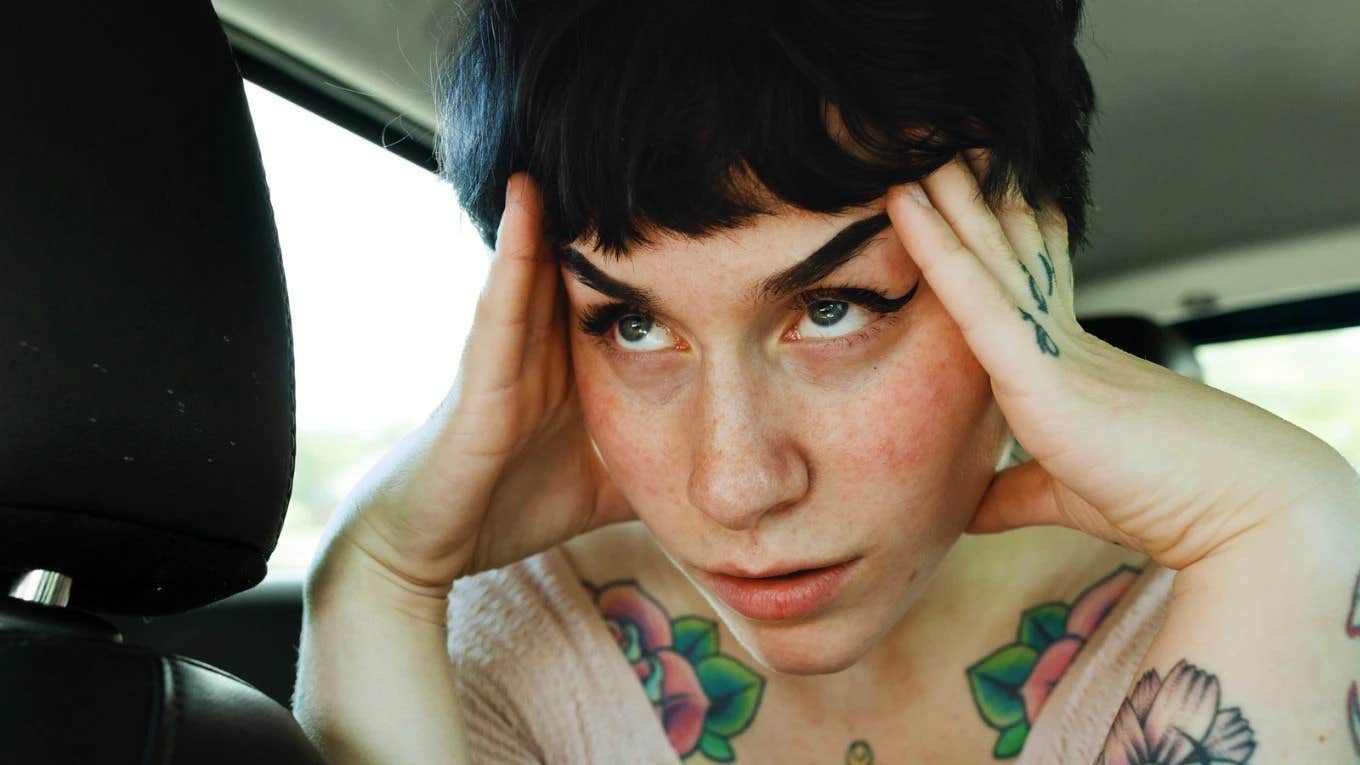 Overwhelmed person pausing for a grounding moment showing the tiny calming fixes to try before you spiral from stress and anxiety.