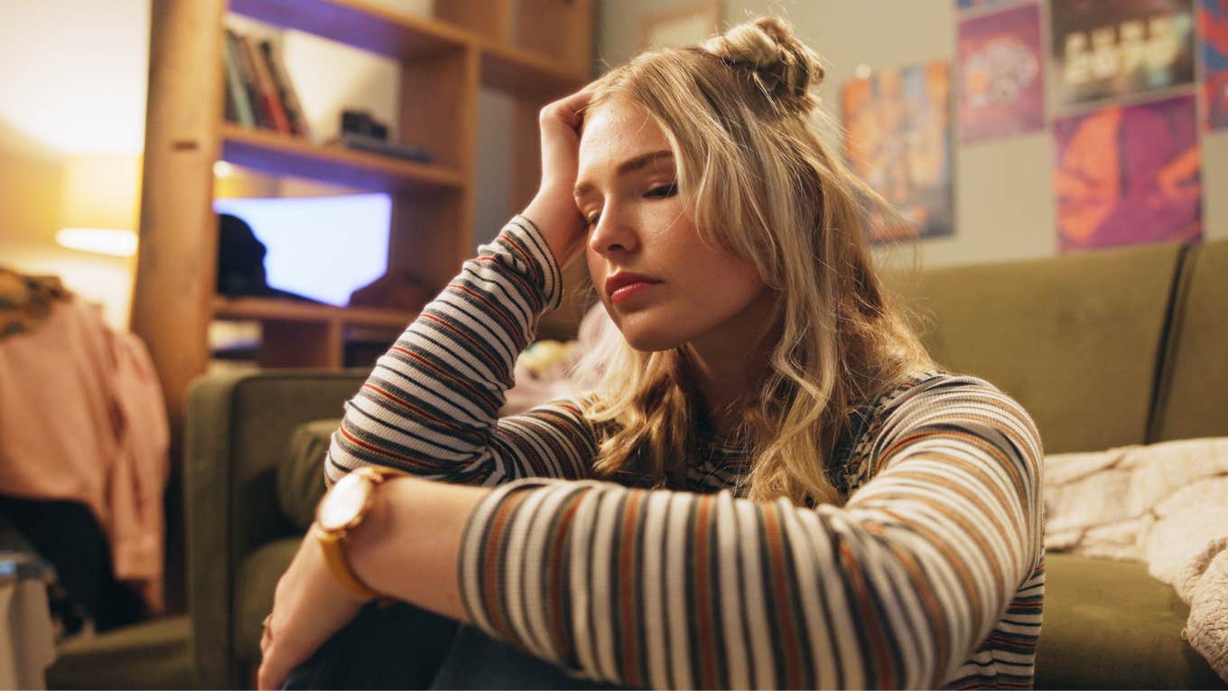 brilliant woman stressed out in cluttered room