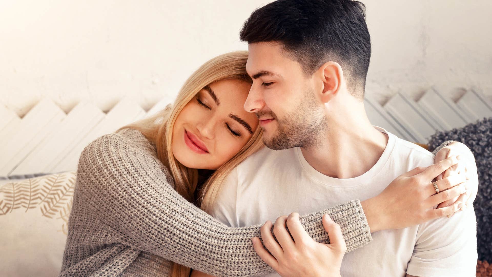 happy couple hugging feeling emotionally safe