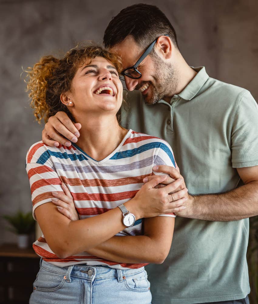 Positive laughing couple are compatible