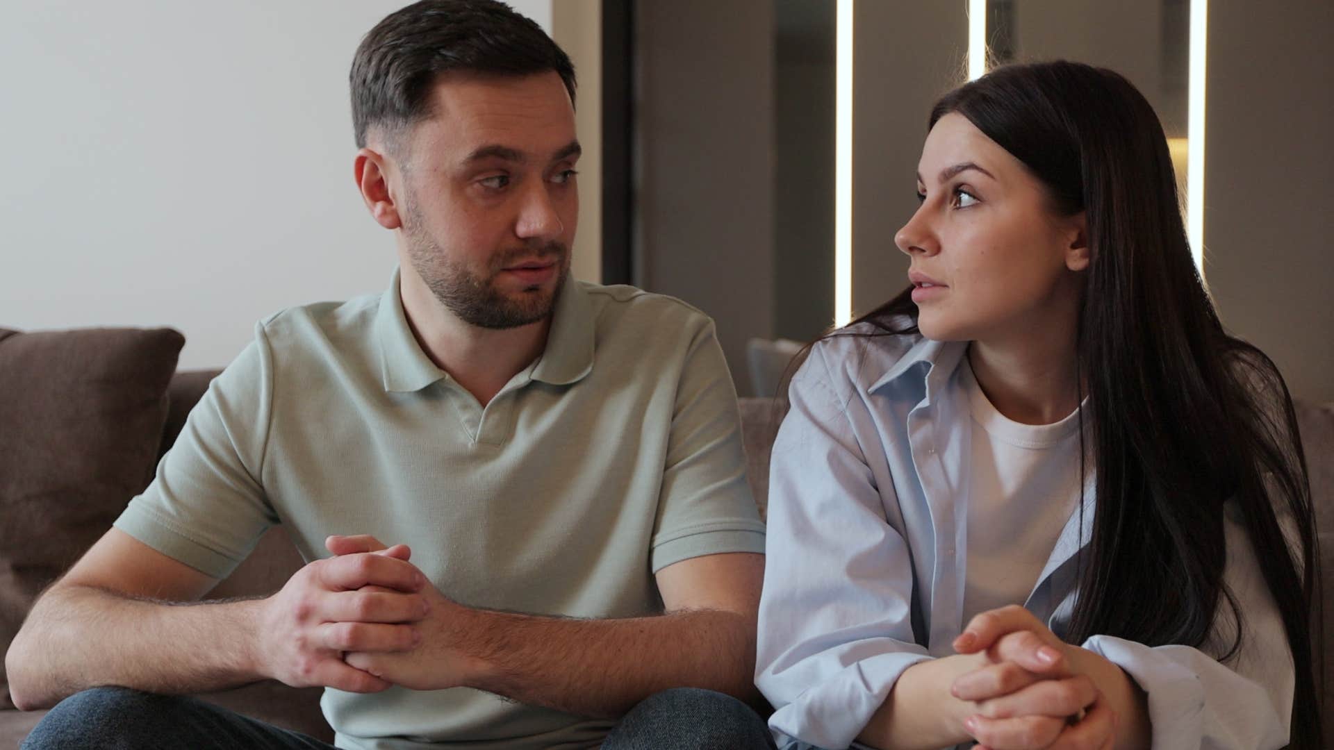 woman looking at her husband and assuming he's fine