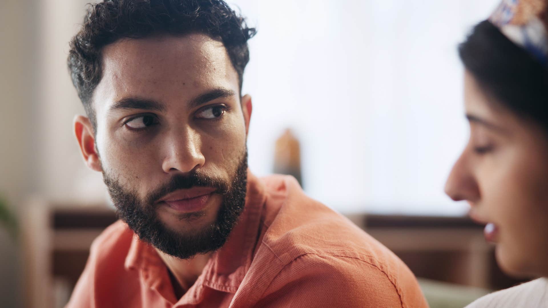 woman interrupting husband in conversation