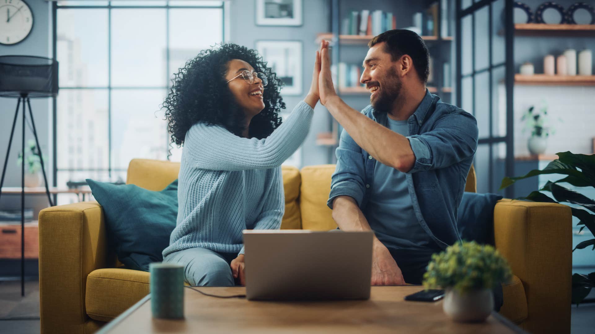 couple high fiving one another as they promise to be on the same team