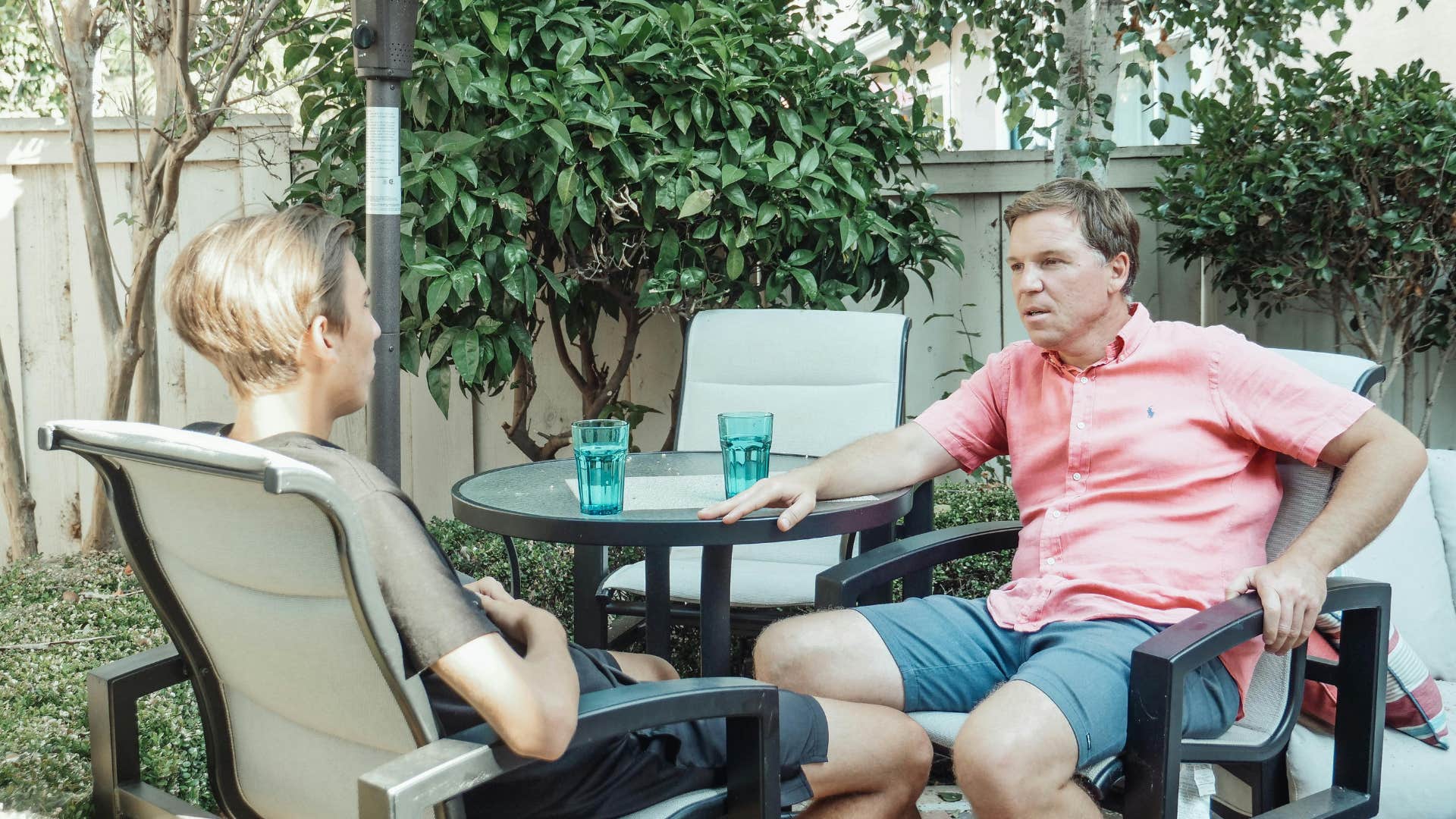 father having conversation with son about his life choices