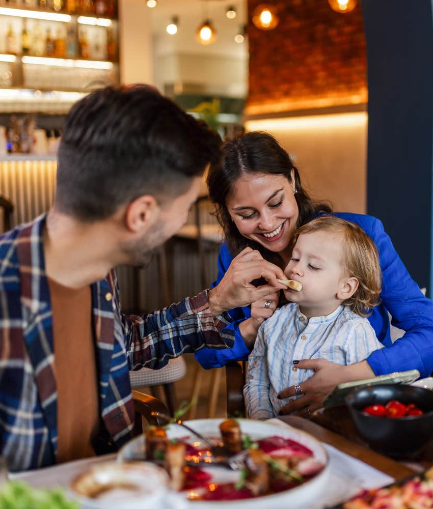family of three eating out at a restaurant