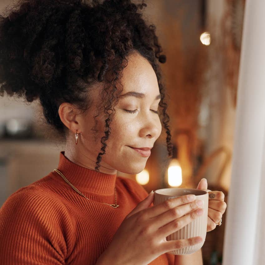 woman who does the everyday habit of drinking herbal tea to help her relax