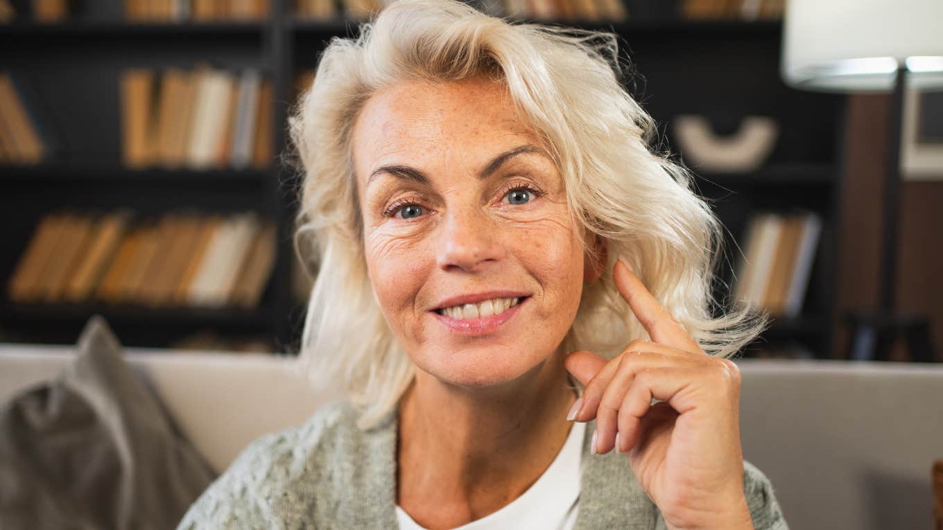 middle aged woman smiling from learning life lessons growing up