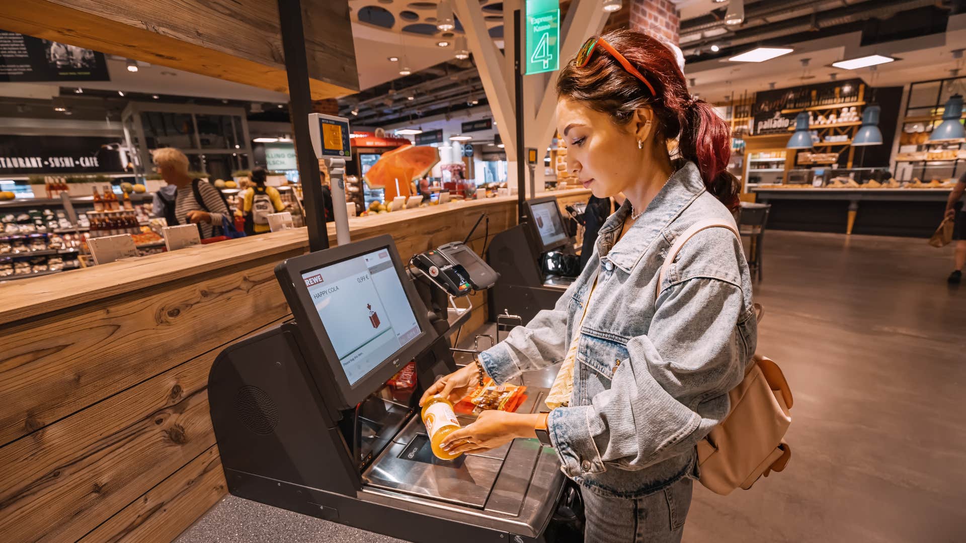woman at the automated checkout
