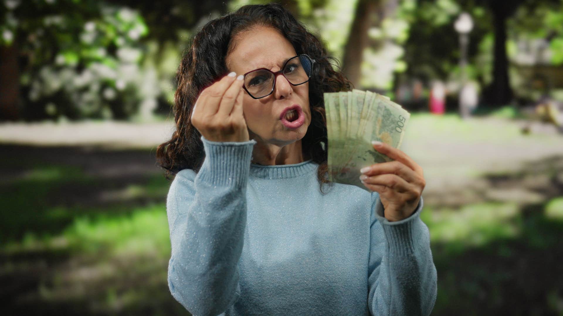 furious gen x woman holding cash money