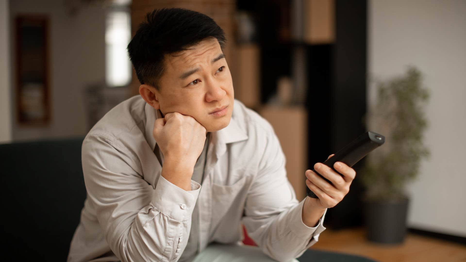 gen x man watching streaming services on his television